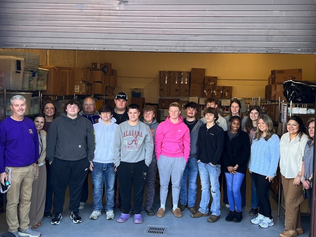 Community High School Football Team Volunteers to Pack Food for Backpack Program
