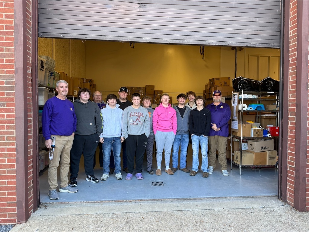 Community High School Football Team Volunteers to Pack Food for Backpack Program