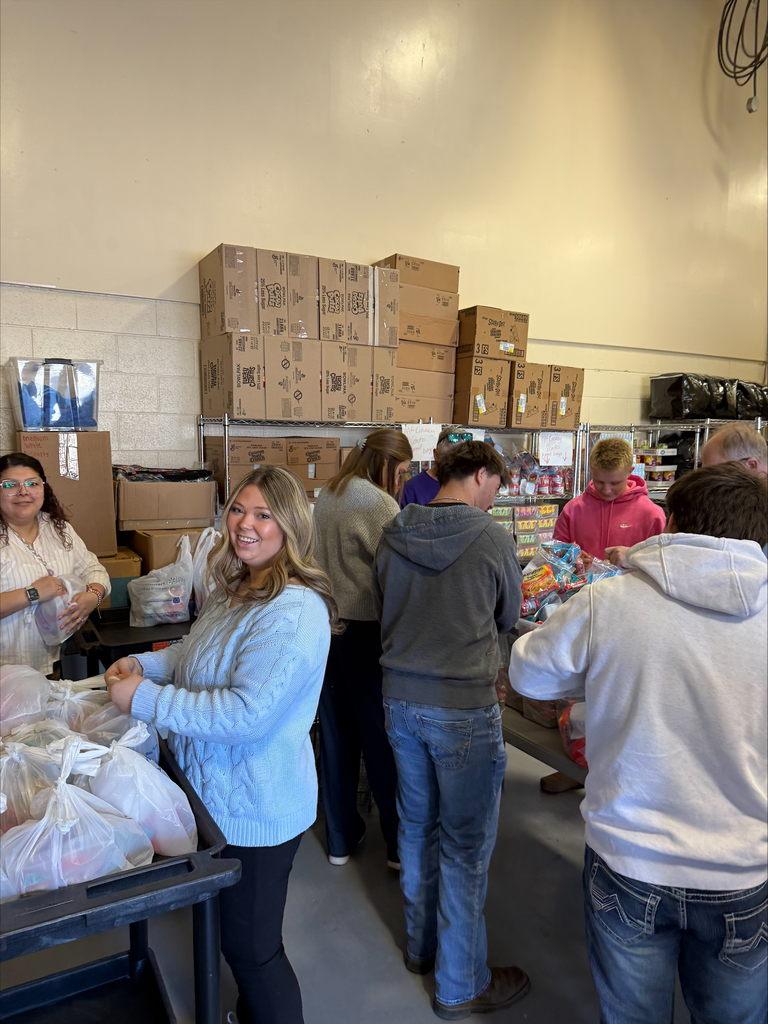 Community High School Football Team Volunteers to Pack Food for Backpack Program