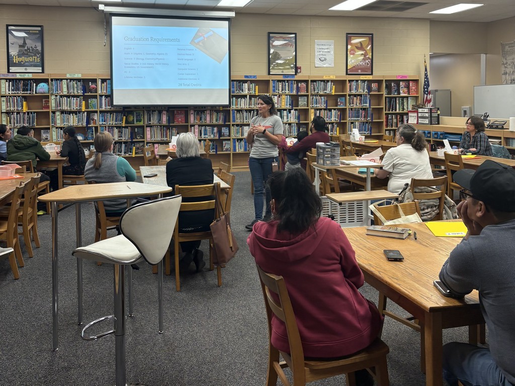 Parent University session in Harris Middle School's library with the Director of Career & Technical Education, Lori Sexton, giving a presentation.