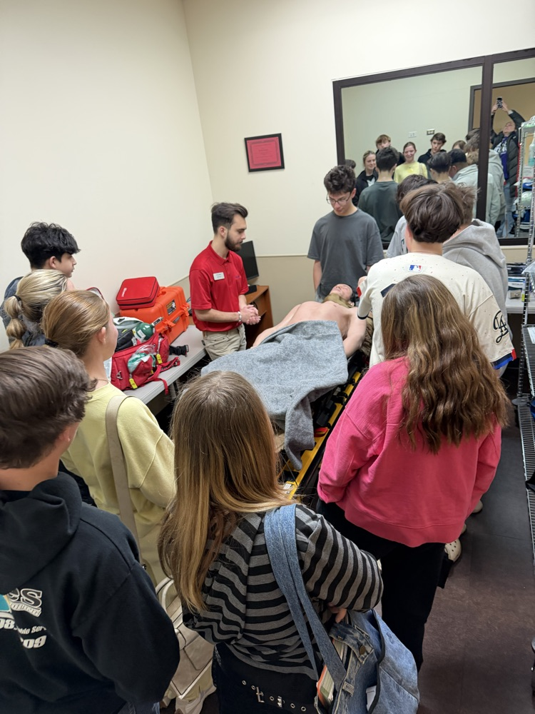 students listening to tour guide