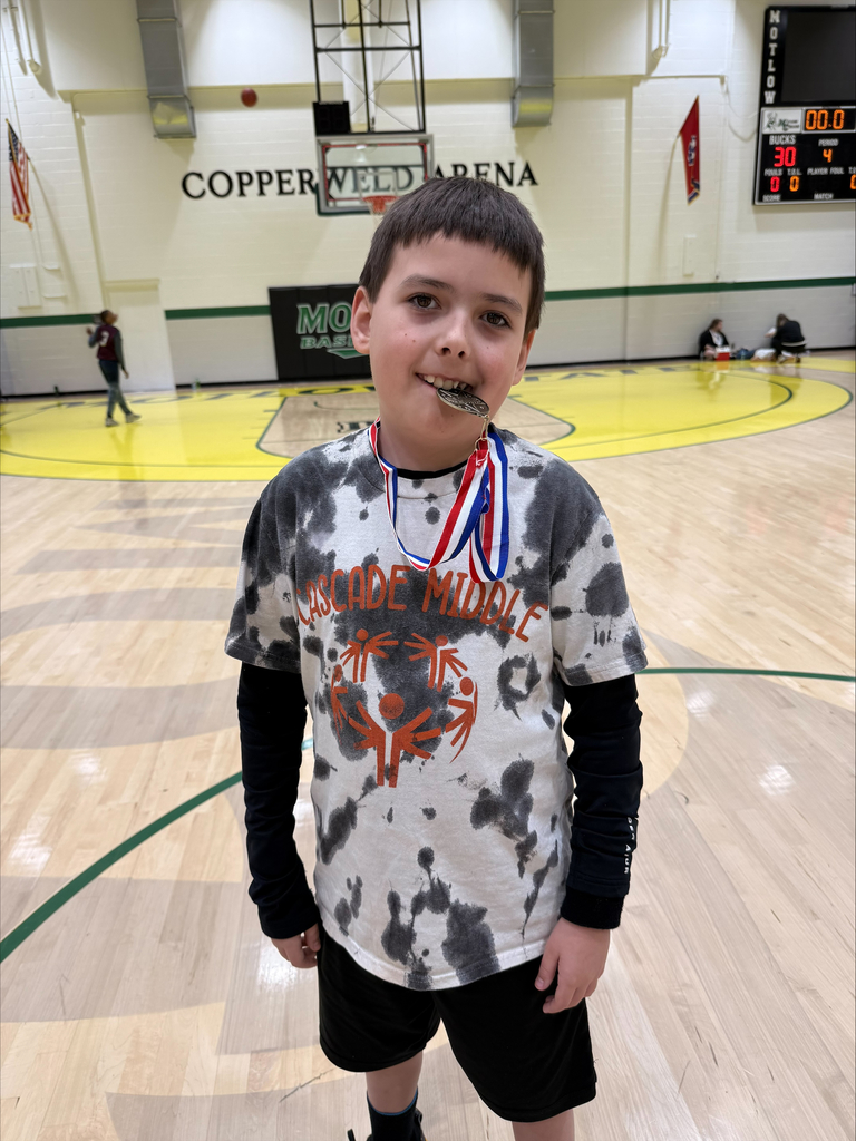 A Cascade Middle School student receives a medal.