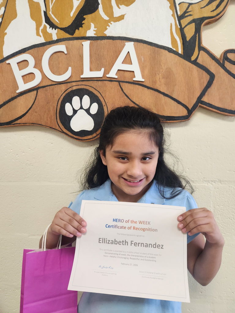 Ellie receiving her HERO certificate