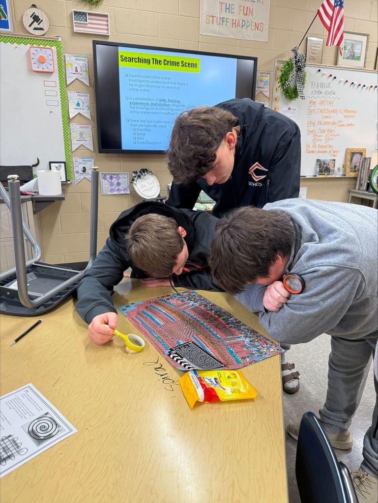 Cascade High School Criminal Justice III students explore the process of examining a crime scene. 