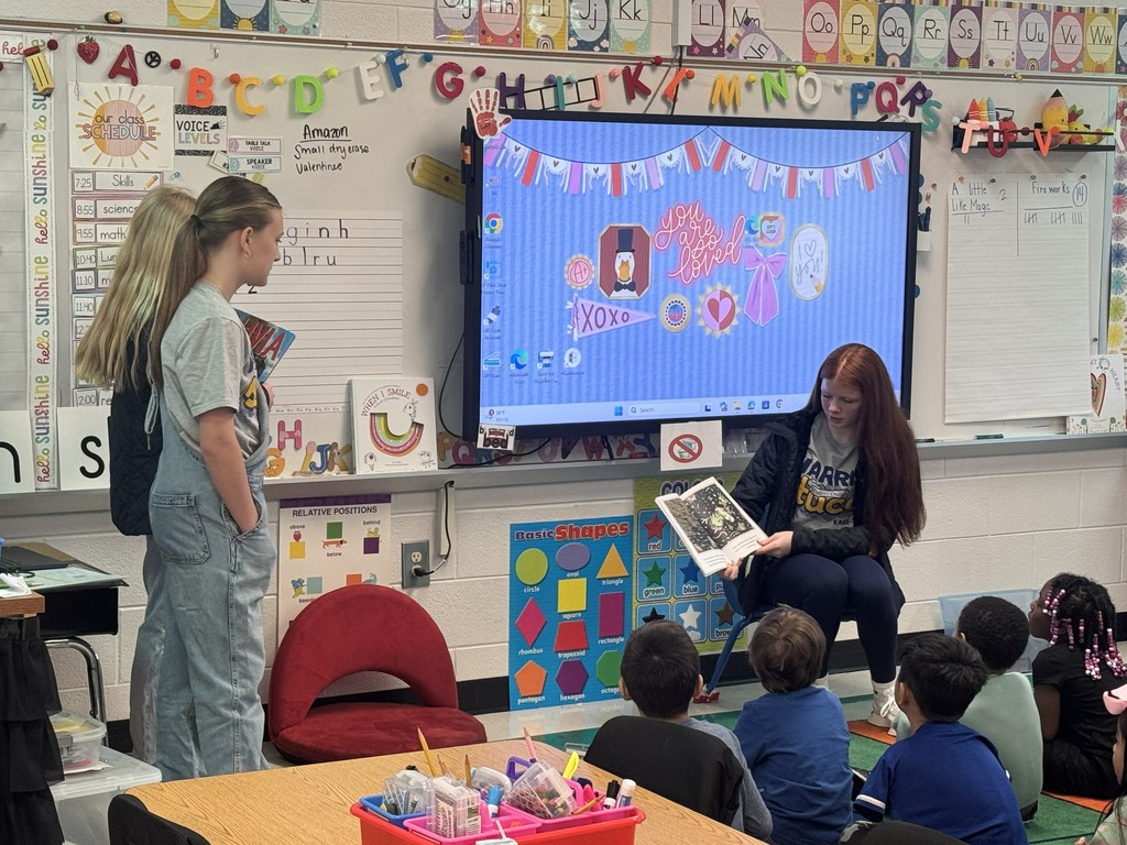 HMS Student Council members reading to students at Learning Way Elementary.