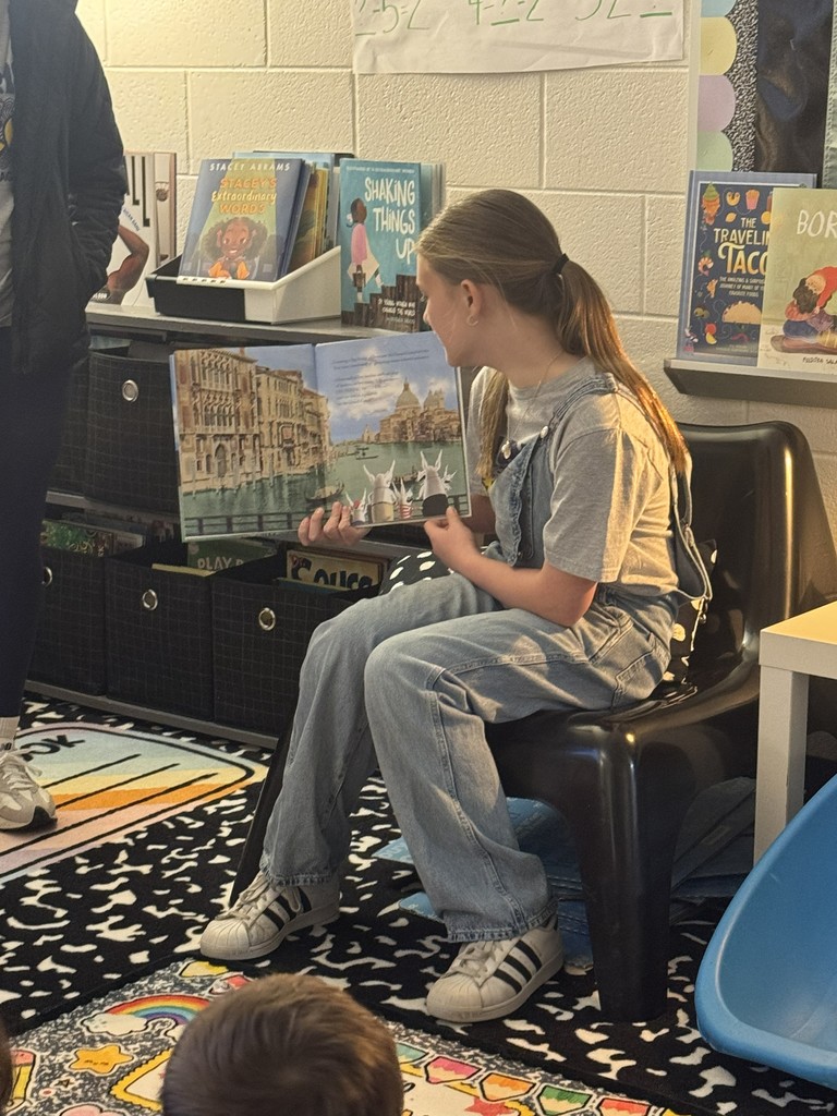 HMS Student Council members reading to students at Learning Way Elementary.