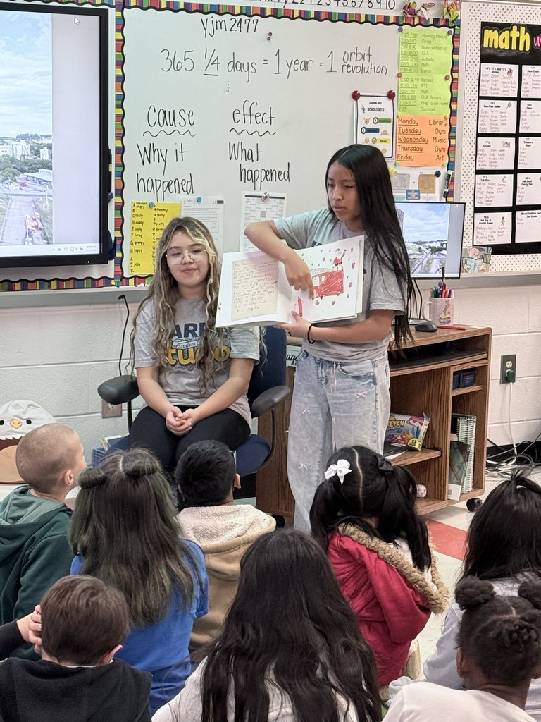 HMS Student Council members reading to students at Learning Way Elementary.