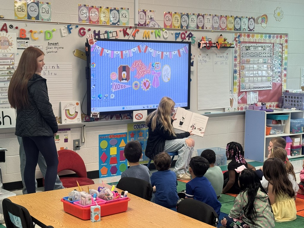 HMS Student Council members reading to students at Learning Way Elementary.