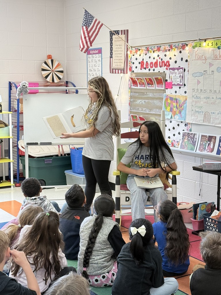 HMS Student Council members reading to students at Learning Way Elementary.