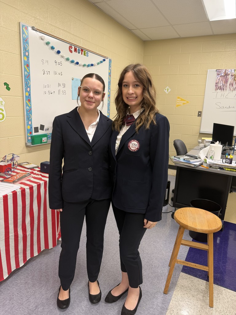 Two students pose for a picture during the HOSA showcase. 