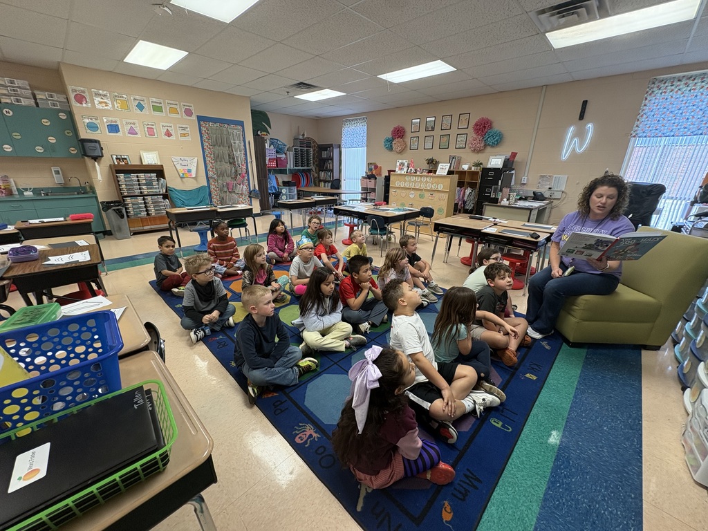 Volunteer reading to 1st grade class