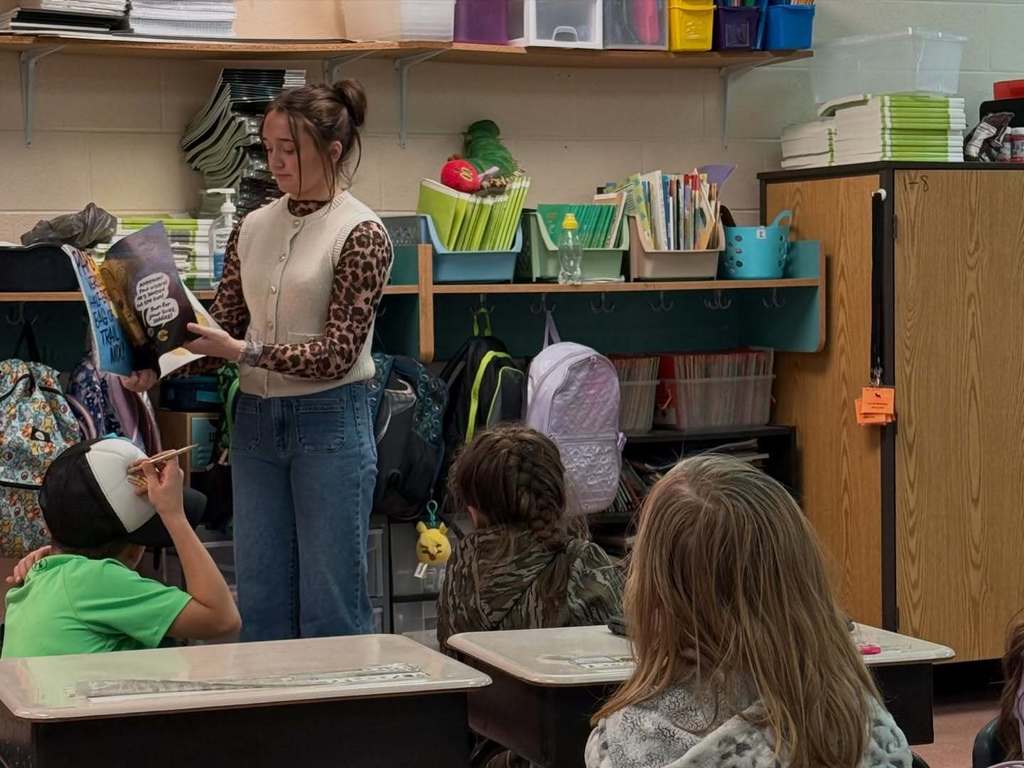Cascade High School Lady Champions read to students at Cascade Elementary School for Read Across America Week.
