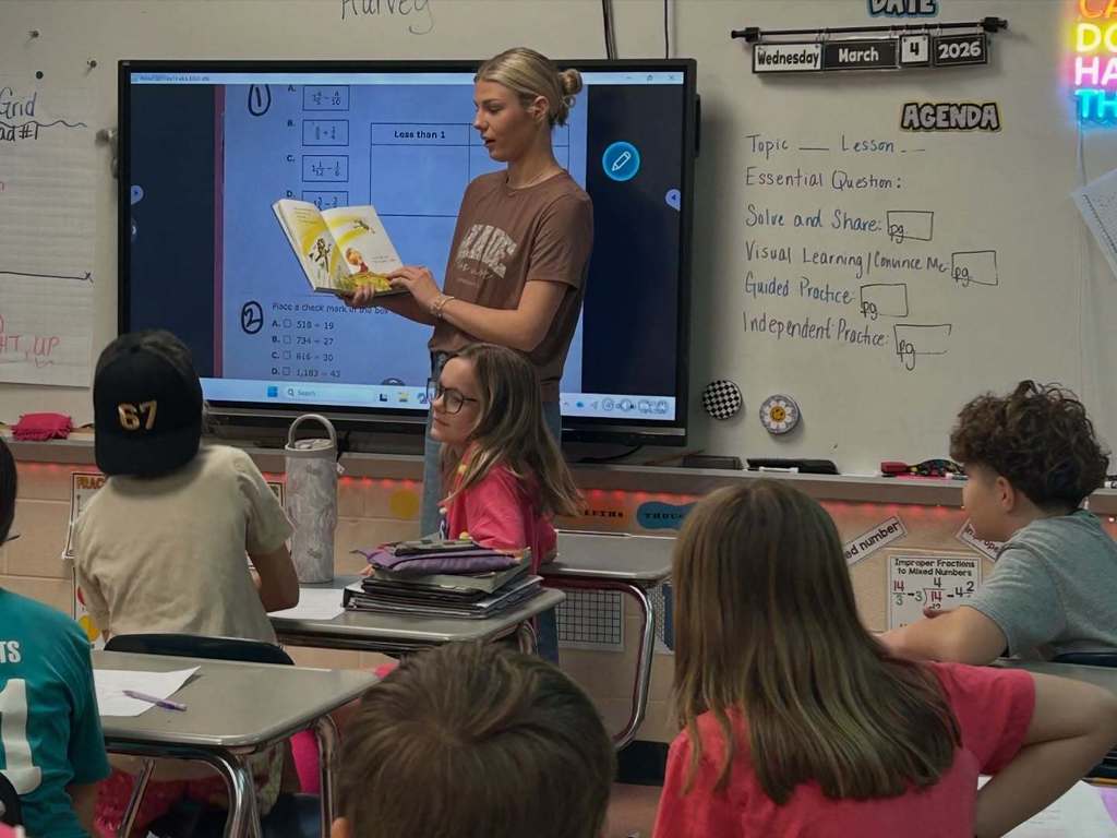 Cascade High School Lady Champions read to students at Cascade Elementary School for Read Across America Week.