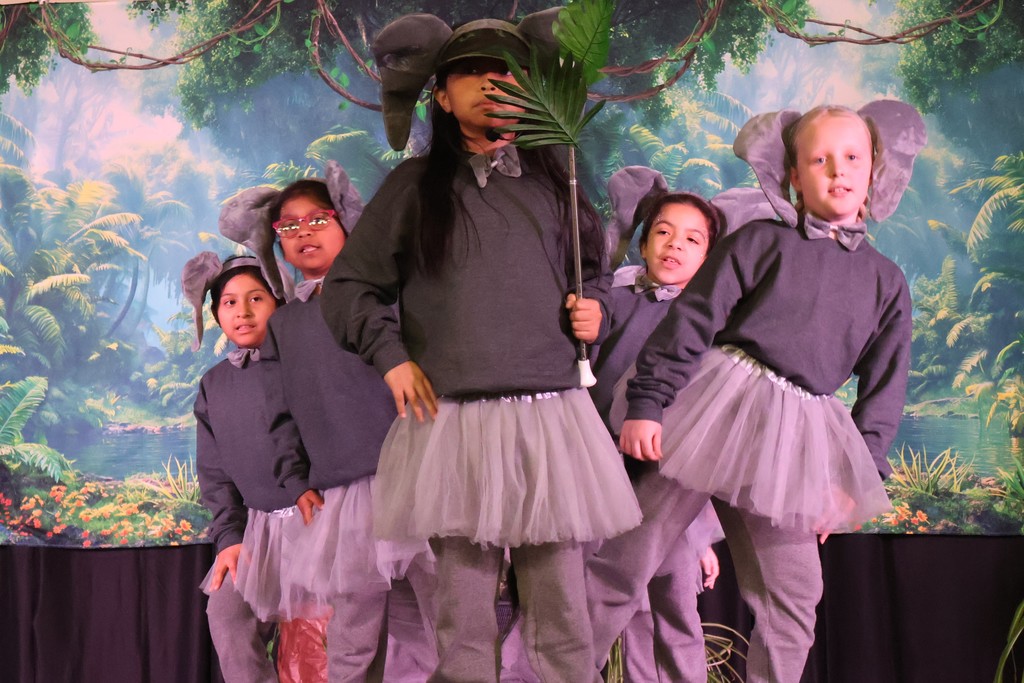 Cast members of Disney's The Jungle Book KIDS – Dual Language Edition play.