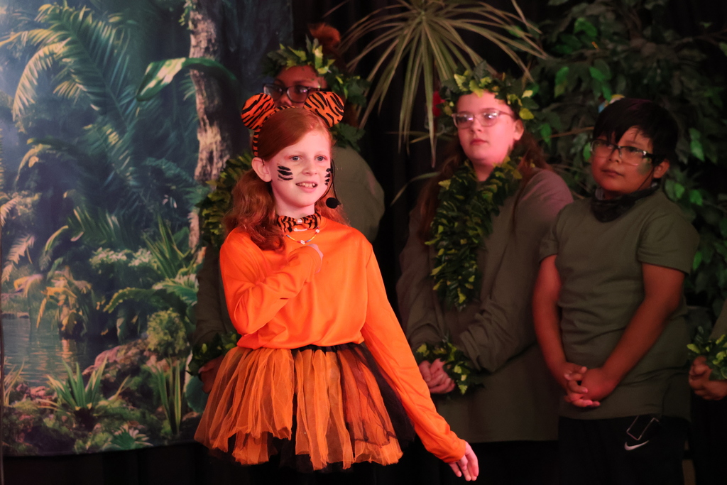 Cast members of Disney's The Jungle Book KIDS – Dual Language Edition play.