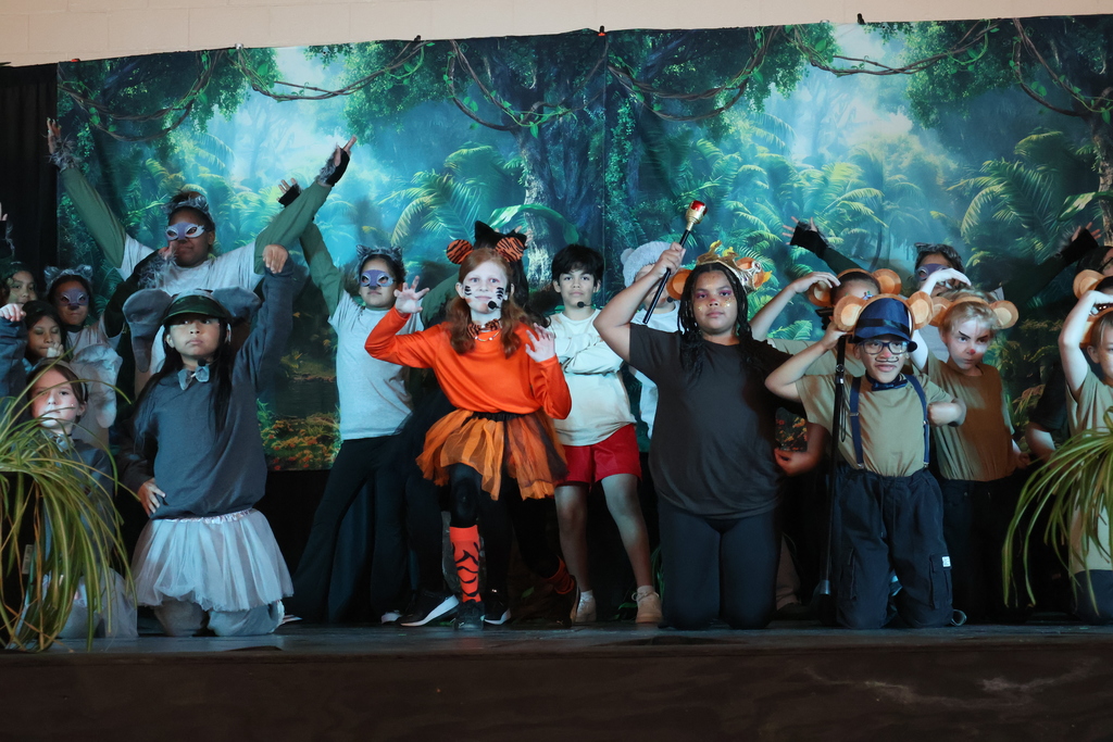 Cast members of Disney's The Jungle Book KIDS – Dual Language Edition play.