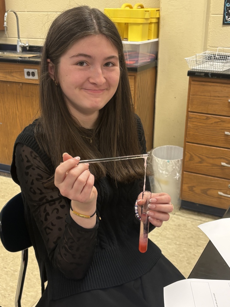 Student extracting DNA from a strawberry.