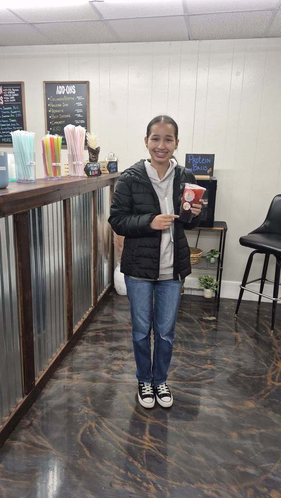 SCHS student receives a drink from Celebration Nutrition for receiving CTE Agriculture Student of the Month.