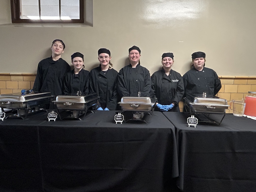 Culinary Arts Students Pose for a Picture Before Serving Lunch