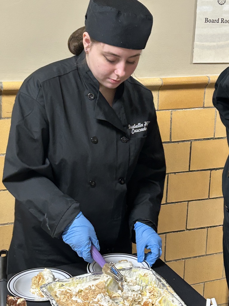 Culinary Arts Student Works to Plate Banana Pudding to be Served. 