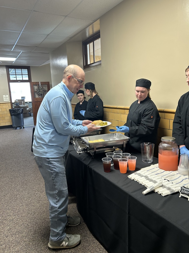 Culinary Arts Students are Serving Lunch at the School Board Members Retreat.