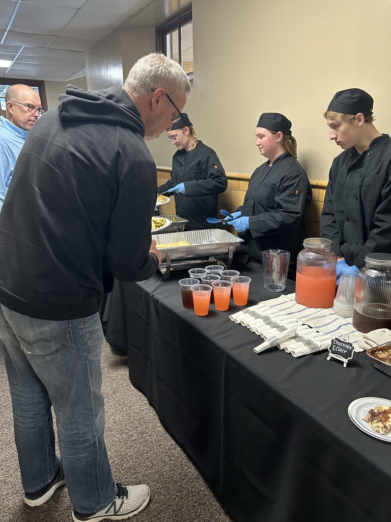 Culinary Arts Students are Serving Lunch at the School Board Members Retreat.
