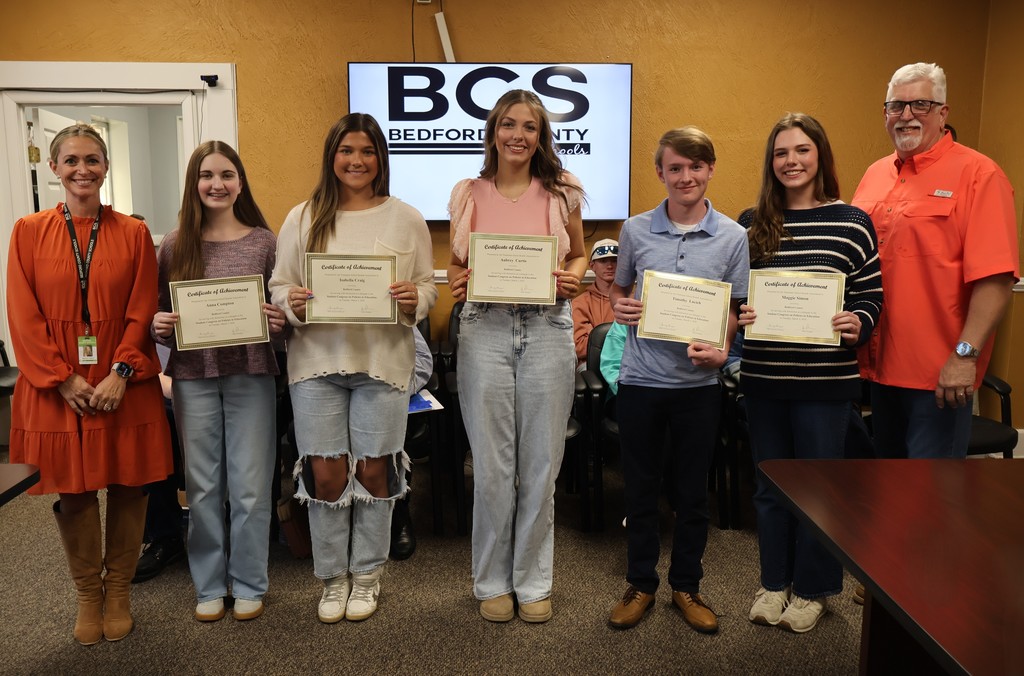Group photo of Tennessee School Boards Association Student Congress on Policies in Education (SCOPE) students at board meeting.