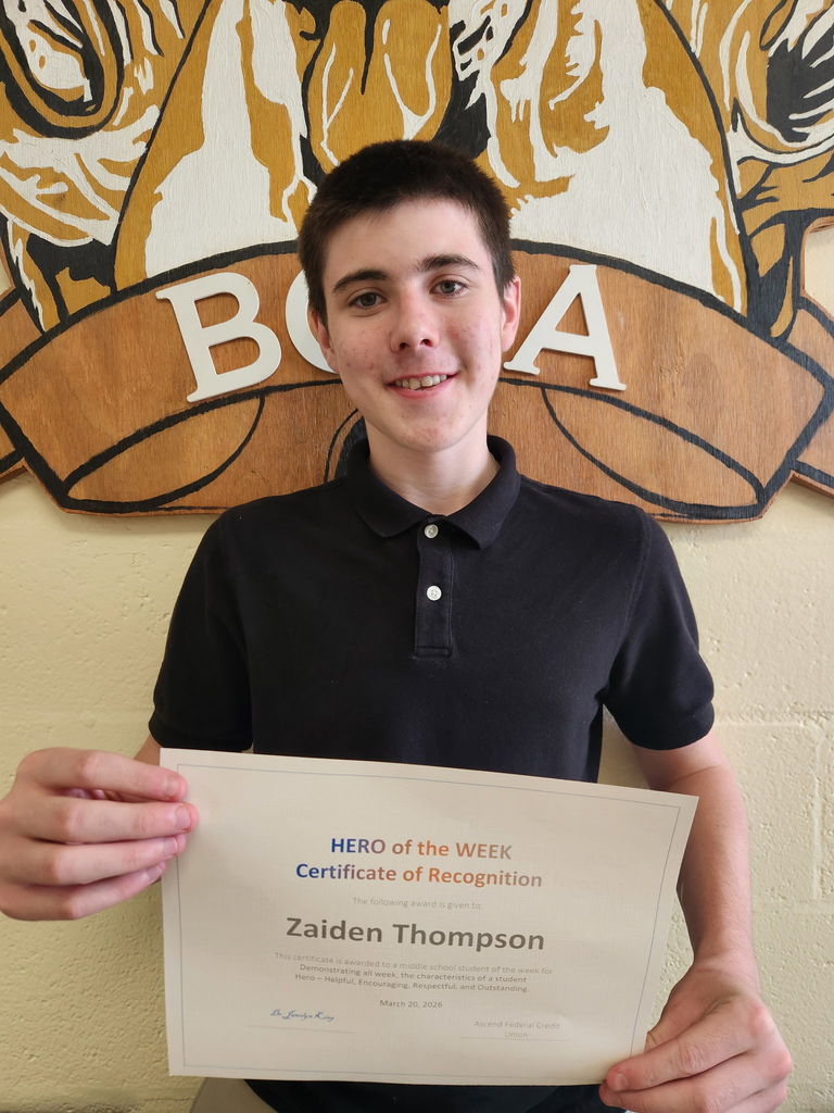 Student receiving Hero of the Week award