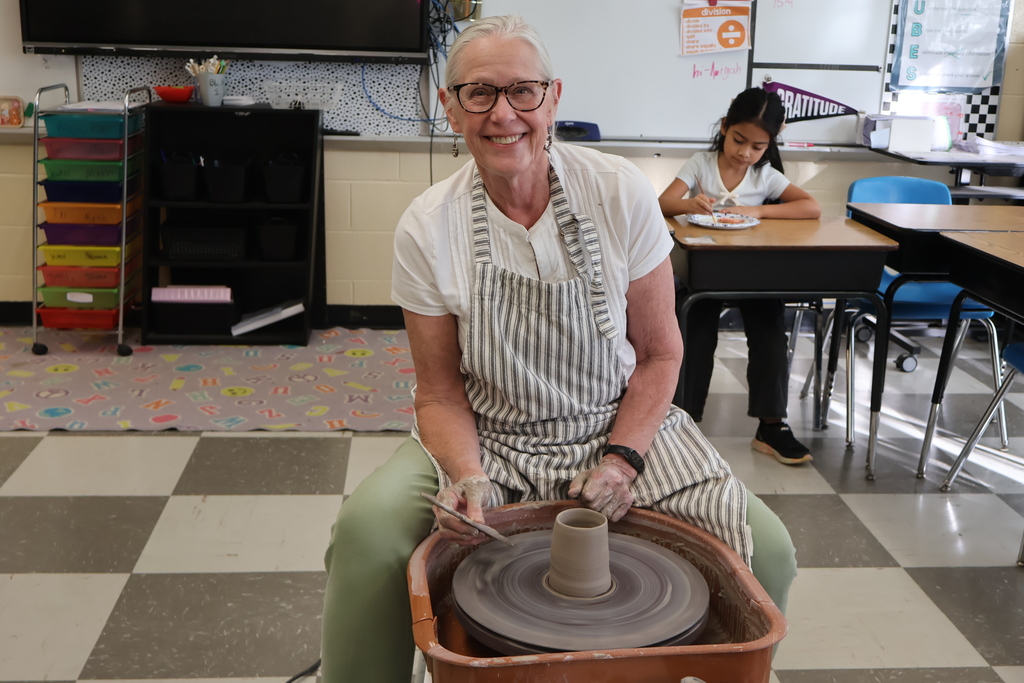Woman making pottery.
