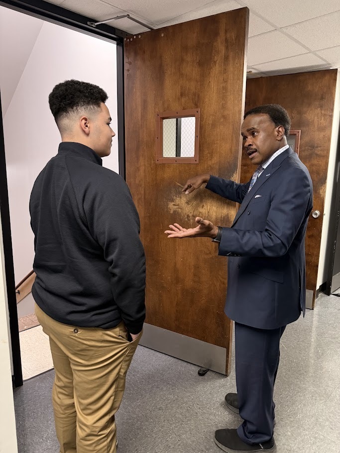 Student talks with Senior Meterologist Lelan Statom.