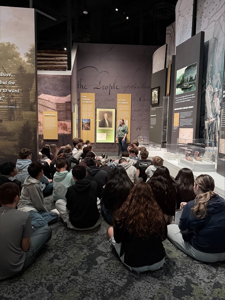 kids listening to a speaker