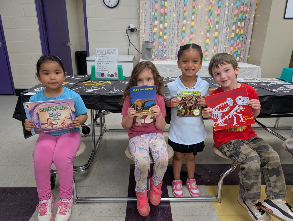 Pre-K kiddos holding dino books