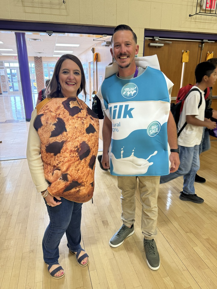 adults dressed as cookie and milk