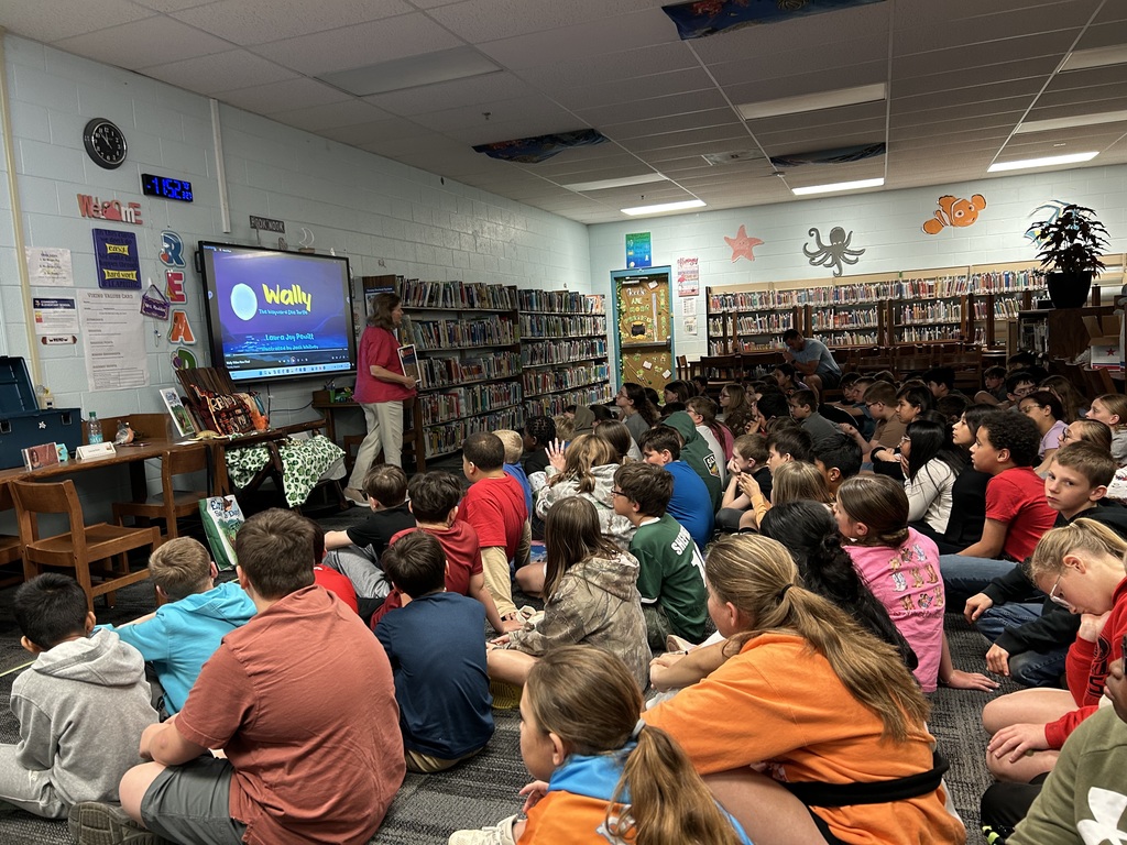 Author visit, students listening and looking at Author