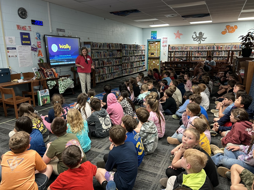 Author visit, students listening and looking at Author