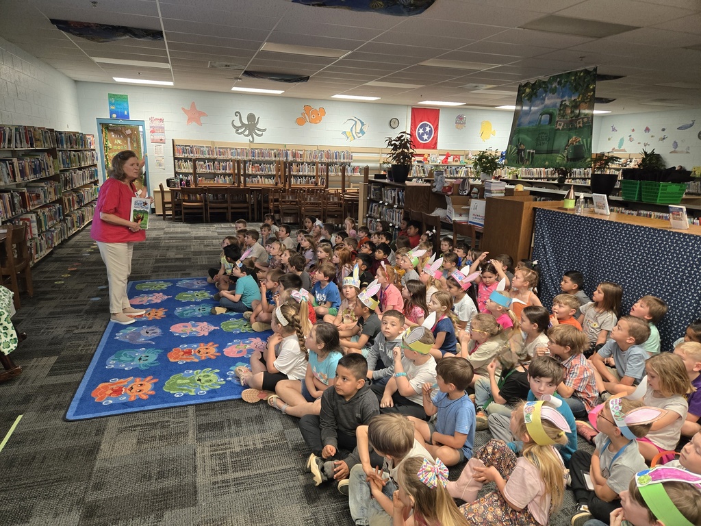 Author visit, students listening and looking at Author