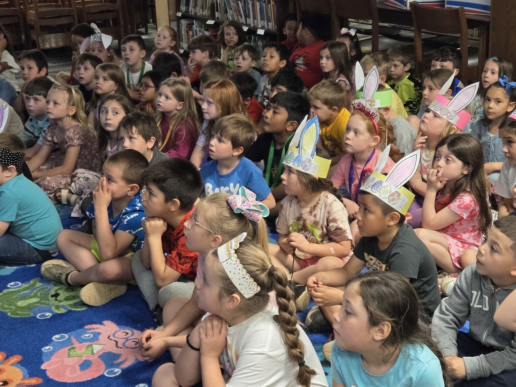 Author visit, students listening and looking at Author