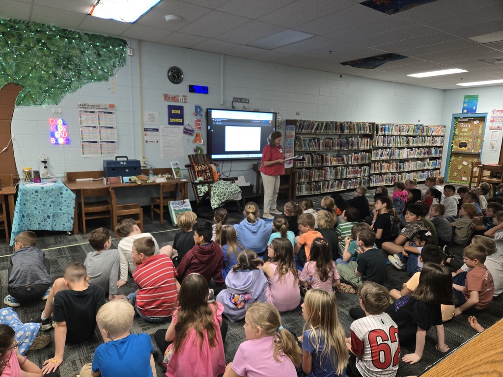 Author visit, students listening and looking at Author