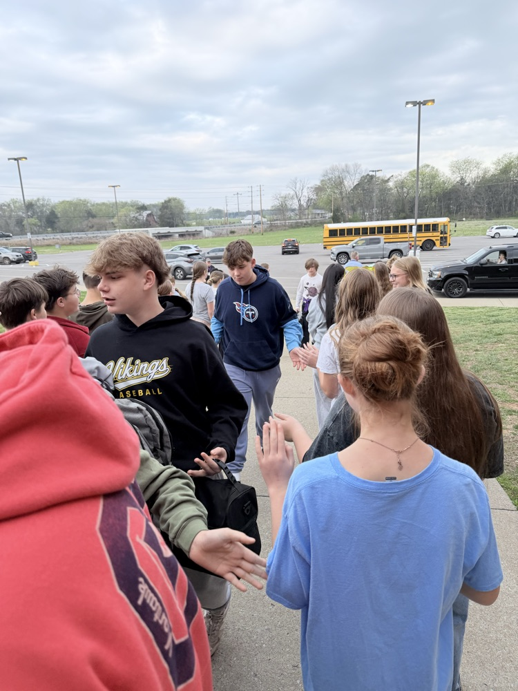 students giving a high five