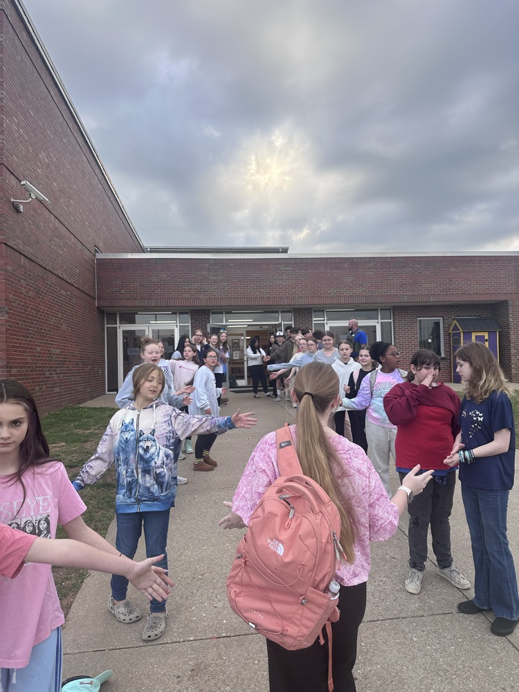 students giving a high five