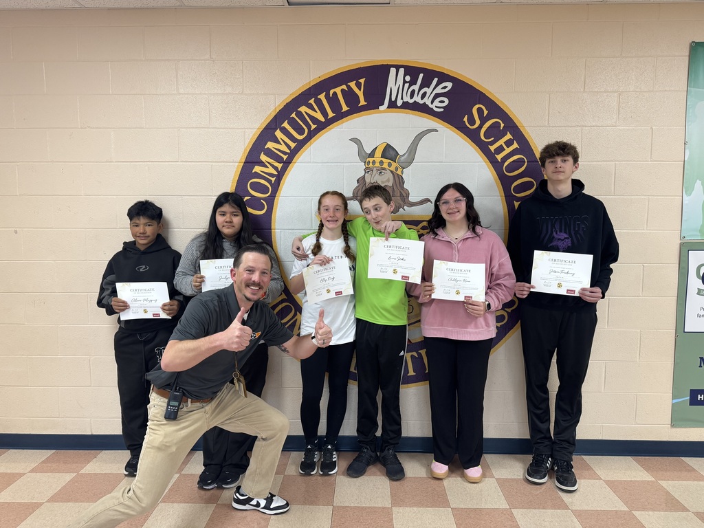 students smiling with certificates