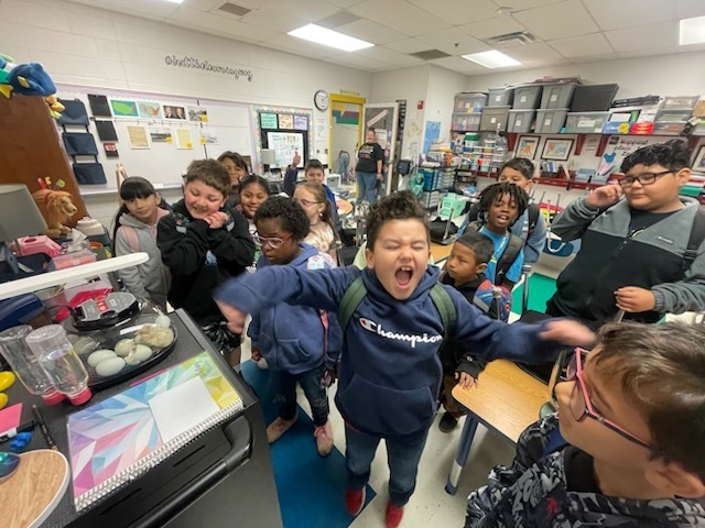 Students in the classroom are excited to find out that the eggs they have been incubating have started to hatch.