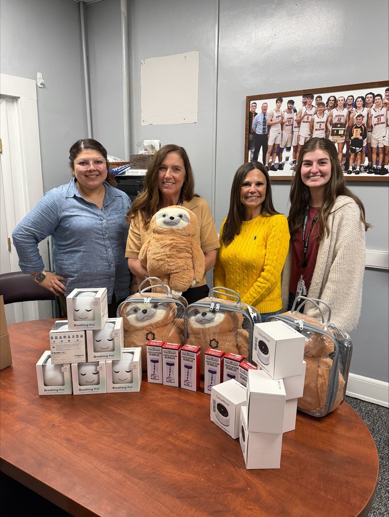The superintendent along with others stand with the calm corner supplies that were donated to Bedford County Schools. 