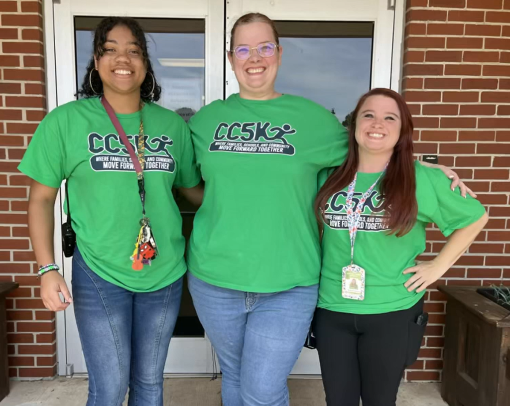 Three staff members from Southside Elementary School pose for a picture wearing their CC5K shirts.