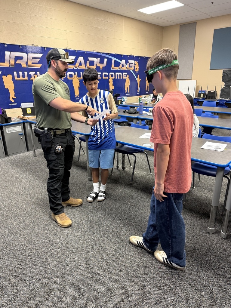 7th Grade Students finding out what it is like to take a field sobriety test.