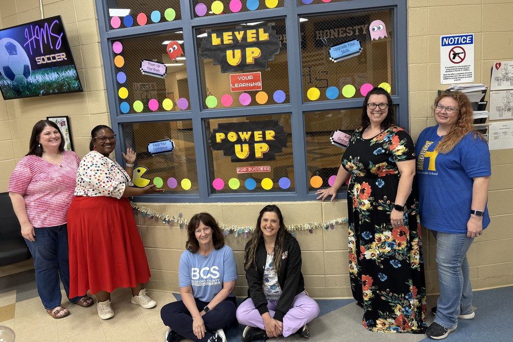 Admin and staff members at HMS are in the hallway where it has some decorations to encourage students during TCAP.