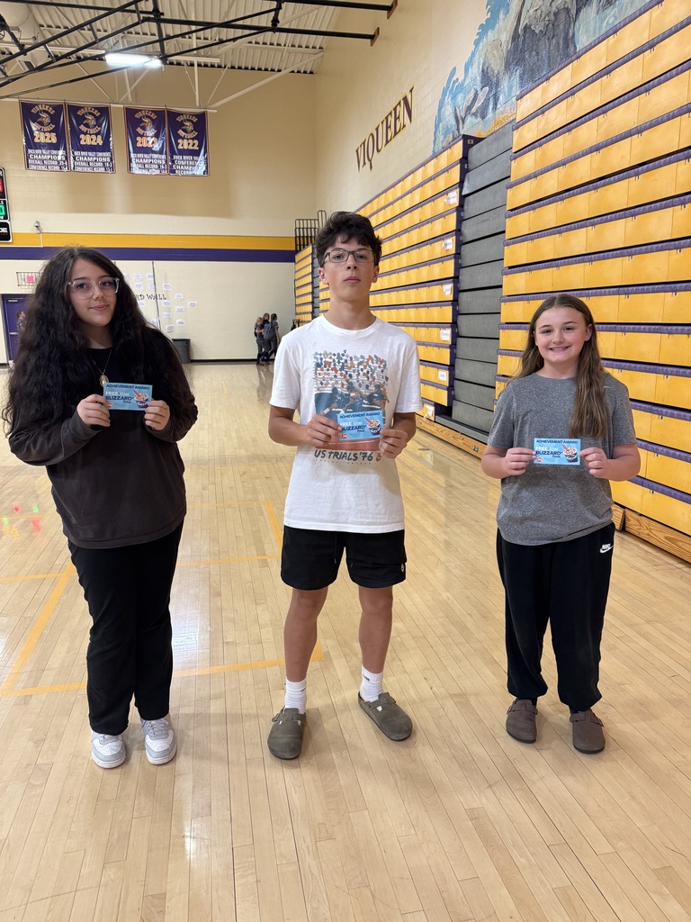 three students smiling