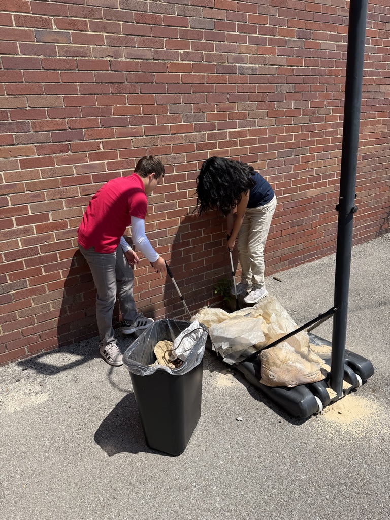 students cleaning up garbage