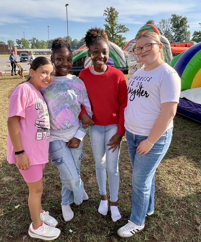 Four students pose for a picture at Learning  Way Elementary's TCAP carnival. 