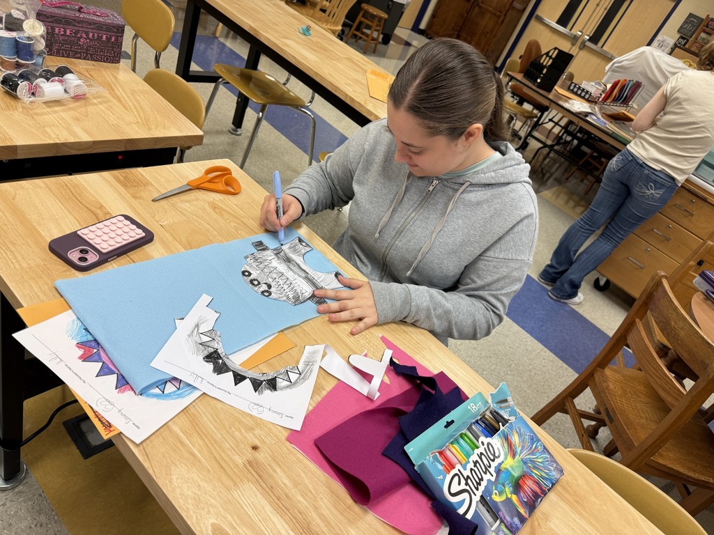 A student works on drawing out the monsters.